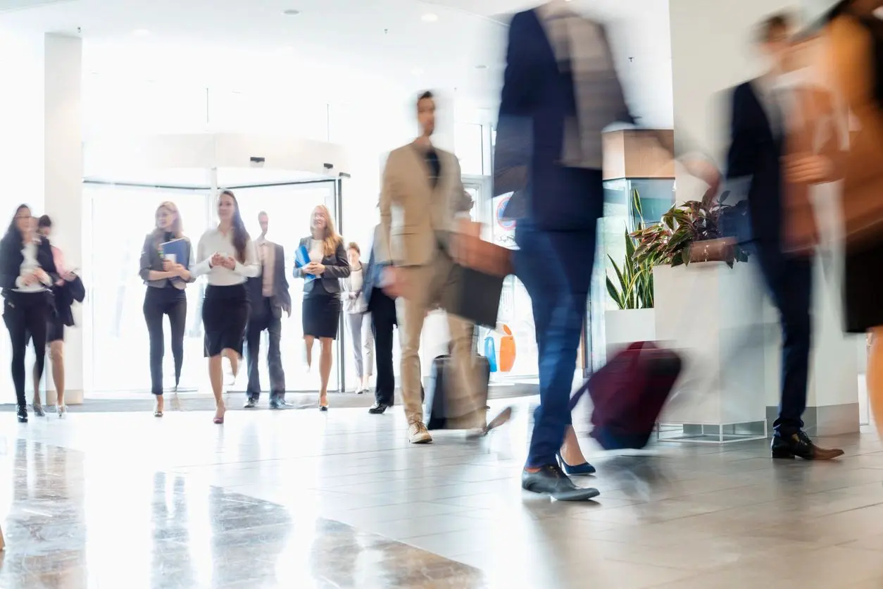 People Walking into a building